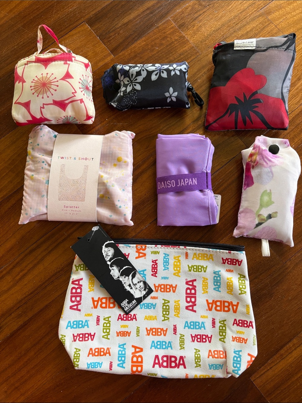 Assortment of ABBA Logo Cosmetic Pouch and Eco Bags